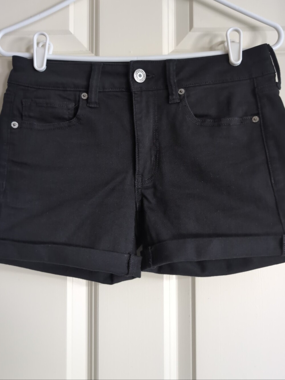 Black mid rise roll cuff stretch denim mini shorts